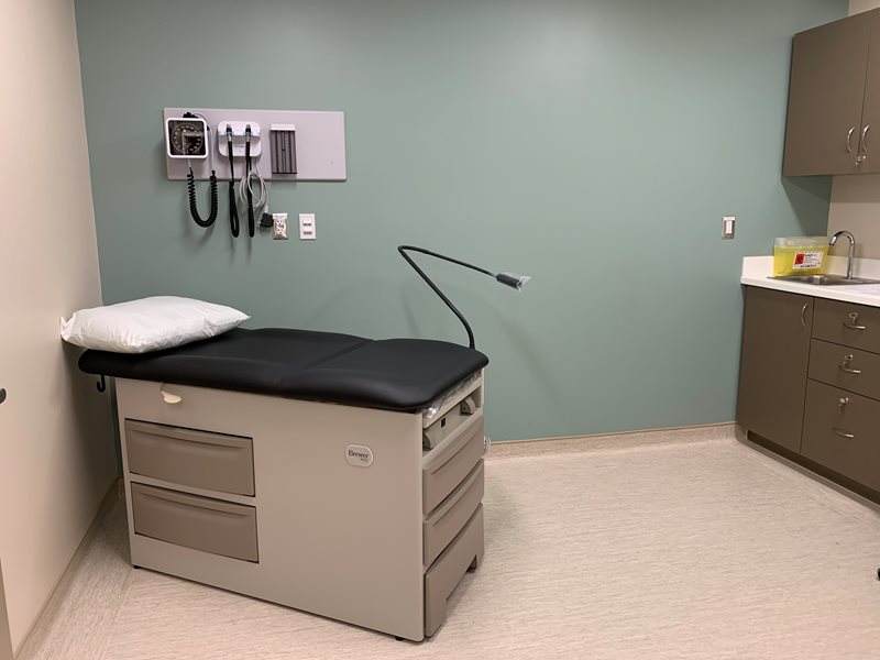 An examination table inside one of the new patient exam rooms in the Brockville Campus Health Centre